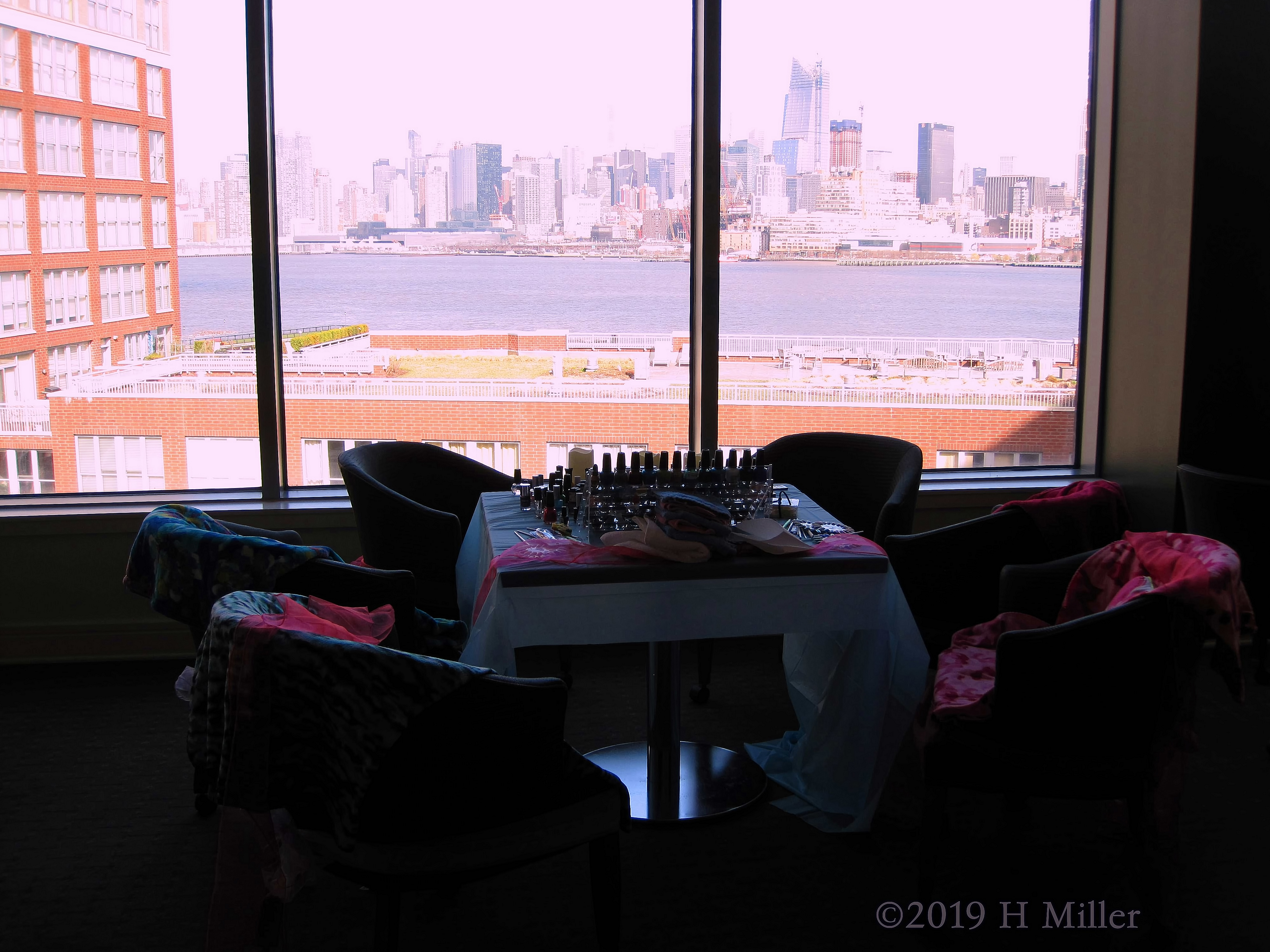 Assortment Of Spa Throws And Nail Polishes With City View Assortment Of Spa Throws And Nail Polishes With City View